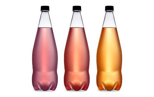 Three clear bottles filled with different coloured drink