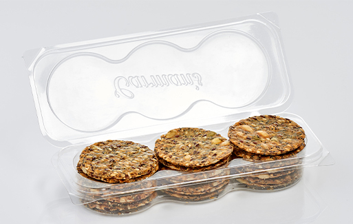 Clear plastic container holding brown biscuits