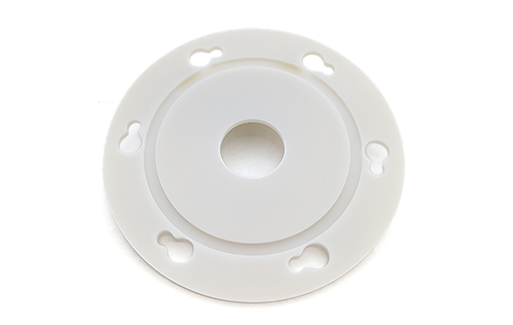 White, round plate with centre hole and six keyholes