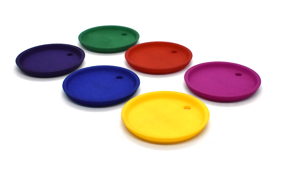 Six small discs with holes in different vibrant colours